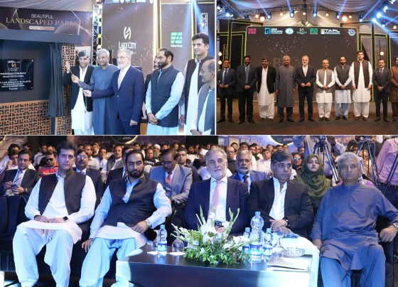 Officials and consortium representatives at Lake City Meadows Phase 1 Extension handover ceremony, including Chairman NAB Lt. Gen. (R) Nazir Ahmed Butt, project developers, and plot owners, marking the formal commencement of possession for residential plots.