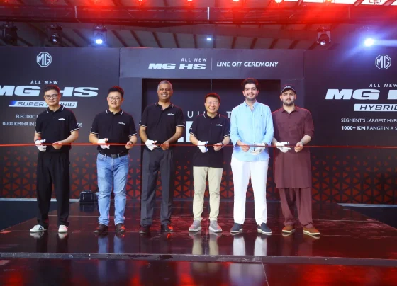 MG Pakistan officials holding a ribbon-cutting ceremony for the CKD line-off of the All New MG HS Hybrid+ and Super Hybrid vehicles.