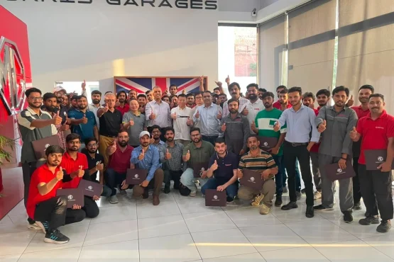 MG Motor Pakistan dealership technicians receiving hands-on hybrid vehicle battery training as part of nationwide after-sales readiness for MG HS Hybrid+ and MG HS Super Hybrid.