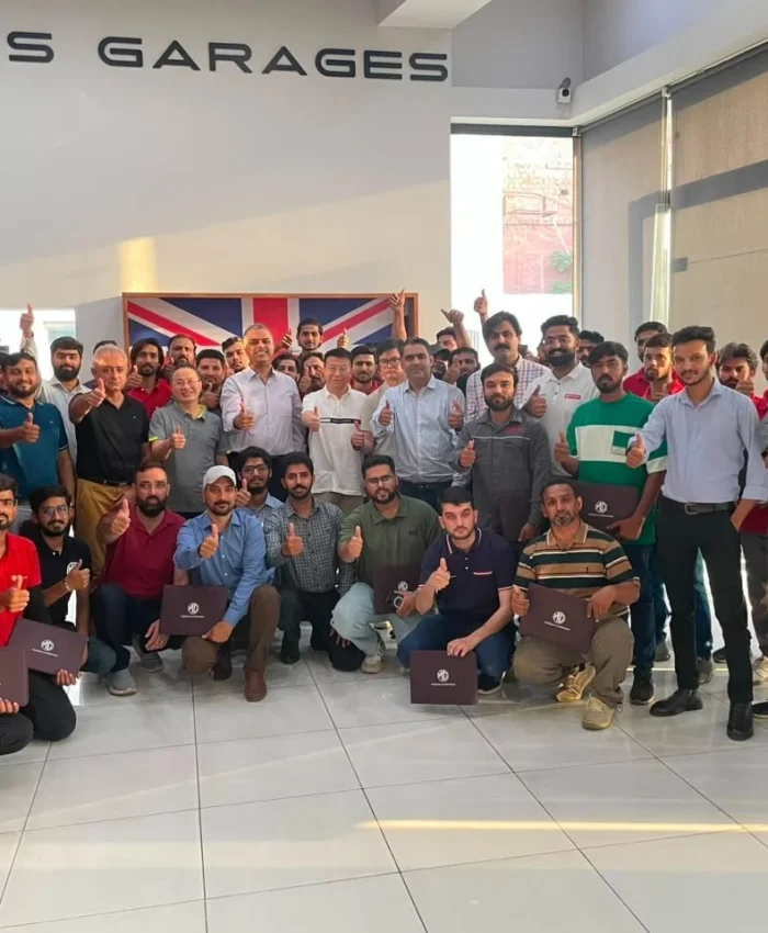 MG Motor Pakistan dealership technicians receiving hands-on hybrid vehicle battery training as part of nationwide after-sales readiness for MG HS Hybrid+ and MG HS Super Hybrid.
